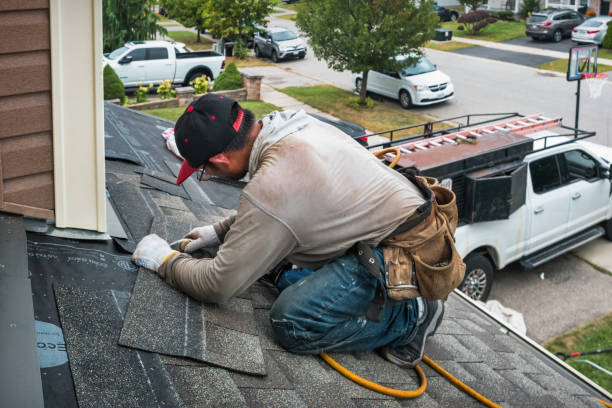 Professional Roofing technician working in Wellington, MO